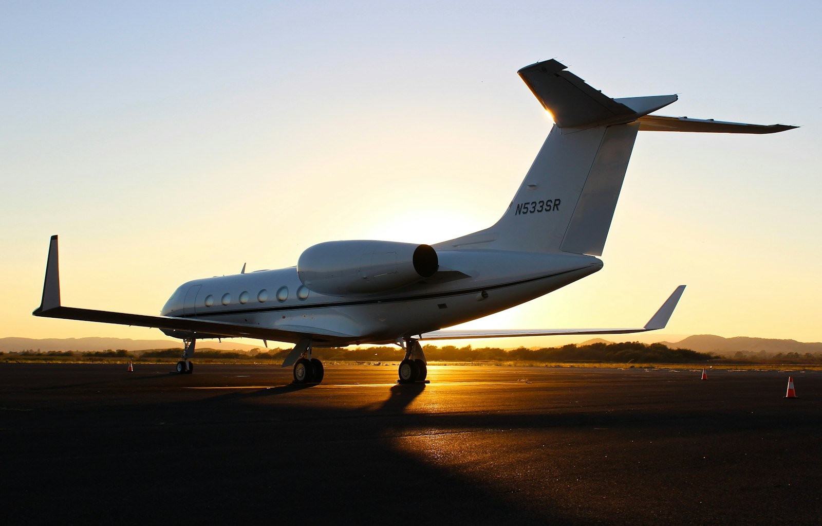 Private jet on the ramp at dusk